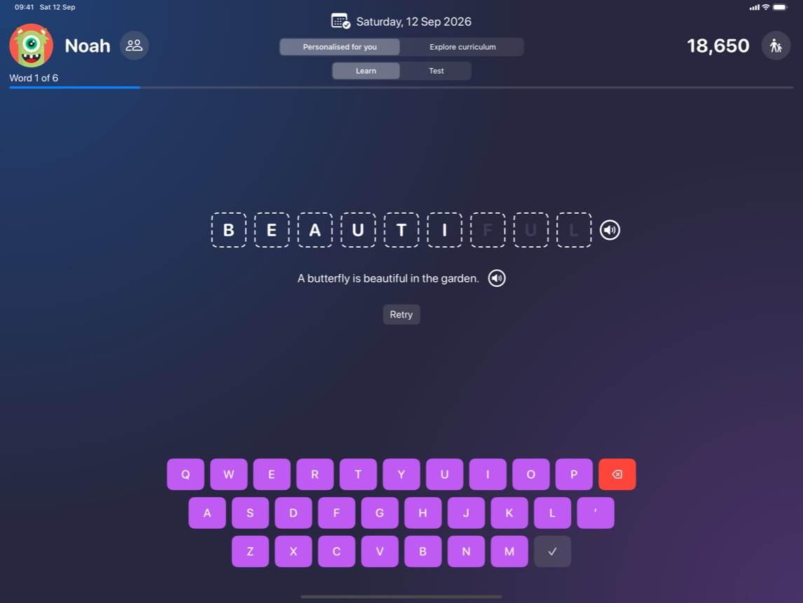 The learning screen on an iPad: the word beautiful being typed into letter boxes above the coloured keyboard, with its sentence underneath